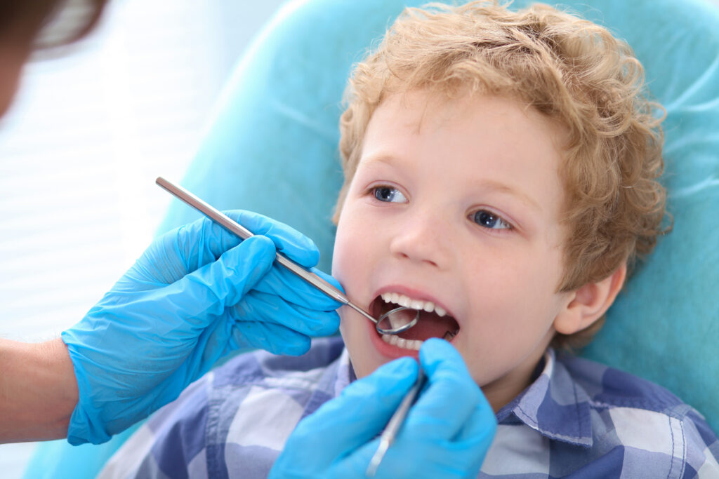 Child being examined by a pediatric dentist in Wylie TX.